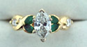 Emerald & diamond engagement ring